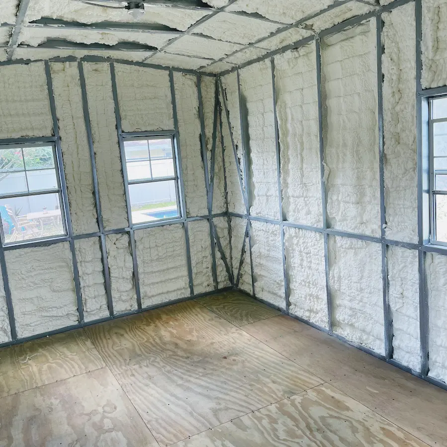 Closed-cell spray foam insulation applied to wall cavities in a residential project in McFarland